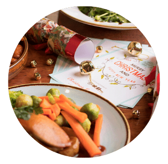 Old Music Shop Restaurant Christmas table with crackers, turkey, carrots, sprouts and menu