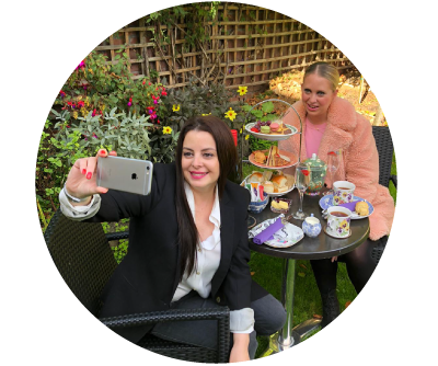 Two beautiful women take a selfie while enjoying Afternoon tea with prosecco at their home in Dublin