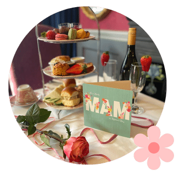 'Mam' Card on table in front of Afternoon Tea Stand with sandwiches, prosecco