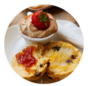 Scone lathered with jam and cream