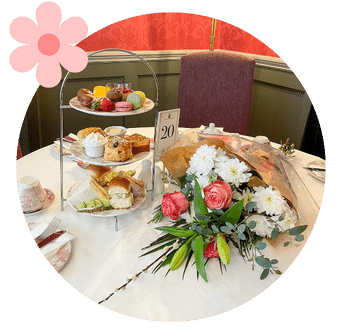 Table set with Afternoon Tea and a large bouquet of flowers at Old Music Shop Restaurant Dublin