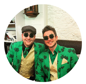 Two men in St Patrick's Day inspired green suits, having fun in Castle Hotel in Dublin