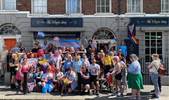 Large Group Smile outside Old Music Shop Restaurant in Dublin just before Parade Starts