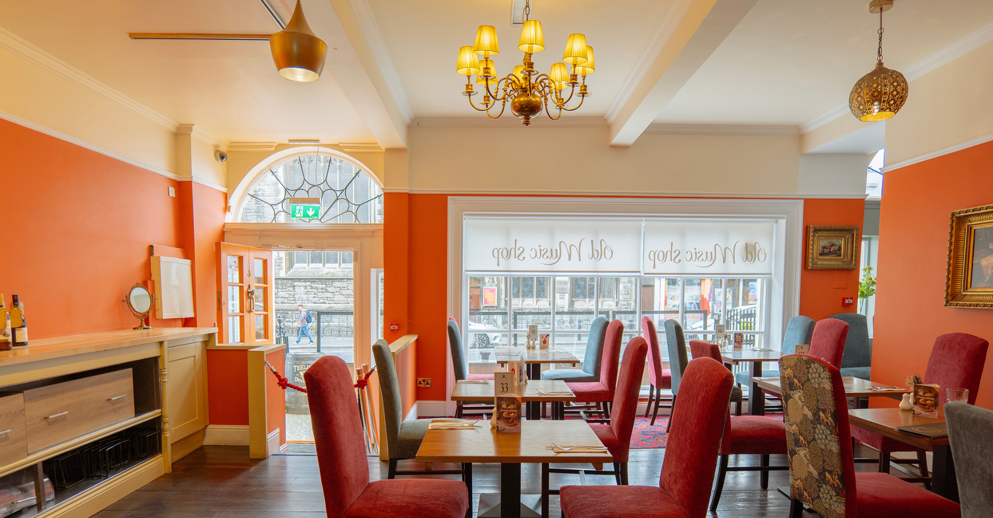 Malahide Room, elegant orange private dining space at the Old Music Shop restaurant Dublin