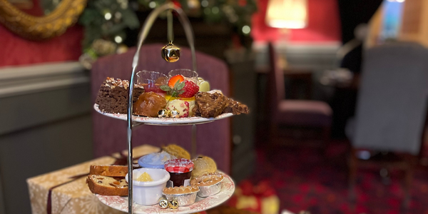 Festive Afternoon Tea selection on a stand with small bell hanging from top. Dublin restaurant