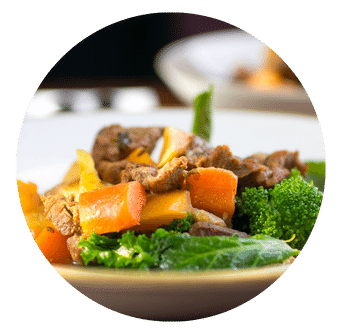 Chunky carrots and other green vegetables and chunks of irish beef with parsnip crisps