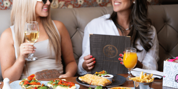 two women smile while enjoying lunch in Dublin