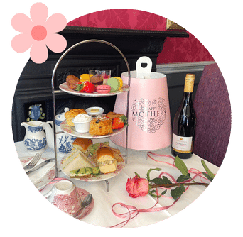 Take Away Afternoon Tea Box in Pink stands beside Tiered Cake Stand in Old Music Shop Restaurant Dublin