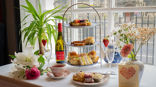 Garden Terrace with tables and chairs and mirror and leafy plants